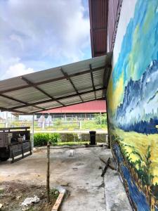 a large painting on the side of a building at E HOME 2 KULAI-Tatami house in Kulai