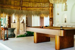 a pool table in the middle of a room at Zazen Boutique Resort & Spa in Bophut