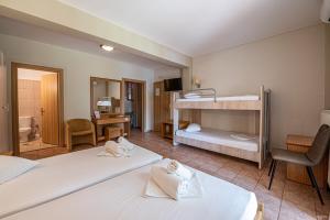 Posteľ alebo postele v izbe v ubytovaní Castella Beach