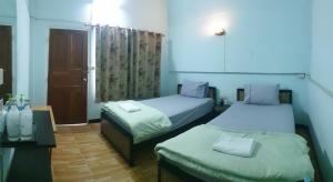 Postel nebo postele na pokoji v ubytování P.L.P Guesthouse - Mae Hong Son