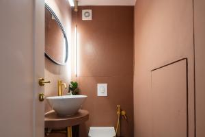 a bathroom with a sink and a toilet at Villa Lemonia in Rethymno Town +37 photos