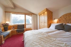 Gulta vai gultas numurā naktsmītnē Albana Hotel Silvaplana