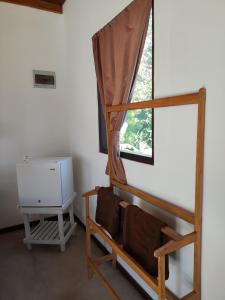 a room with a bunk bed and a window at Arazo villa in Unawatuna