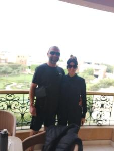 a man and a woman standing on a balcony at Grand Museum Pyramids Inn in Giza
