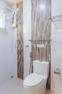 a bathroom with a toilet and a shower at MEHEL - Holiday Home - Mahibadhoo in Mahibadhoo