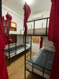 a room with three bunk beds in a building at Aurora Backpackers Hostel in Luang Prabang +85 photos