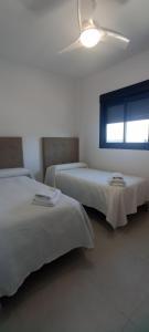 Cama o camas de una habitación en APARTAMENTO TURISTICO EN LEBRIJA