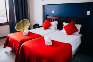 Llit o llits en una habitació de Hoedjiesbaai Hotel