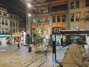 a view of a city street at night at Main Inn Taipei in Taipei