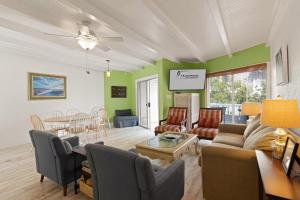 a living room with a couch and a table at East Beach Villa Unit 204 in East End