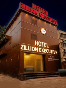 a hotel with a sign on the side of a building at Hotel Zillion Executive - Kurla West Mumbai in Mumbai
