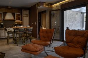 a barber shop with chairs and a table at TheLuxuryVillas in Preveza