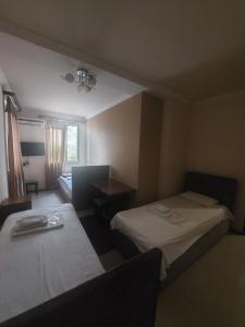 Voodi või voodid majutusasutuse Home Hotel toas