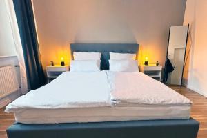 Säng eller sängar i ett rum på Modernes City-Apartment nahe Messe Düsseldorf