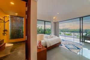 Postel nebo postele na pokoji v ubytování Akala Villa Hoi An