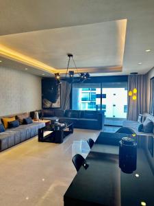 a large living room with couches and a table at Apart luxe in Casablanca