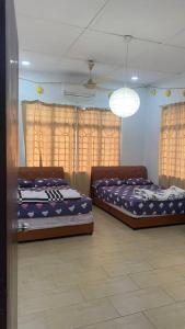 A bed or beds in a room at Bungalow with Private pool at Kajang Sg Chua