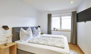 Postel nebo postele na pokoji v ubytování Apartment ZUM Fuchs