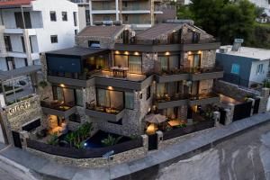 an aerial view of a house with lights at Opal Executive Suites in Nafplio