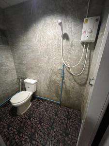 a bathroom with a toilet and a shower at A.P.guesthouse in Ko Mak