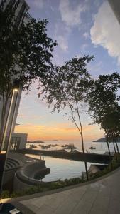 a view of a body of water at sunset at MMJ Homesuite @ The Shore in Kota Kinabalu