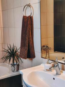 a bathroom with a sink and a mirror at Barbati Sunrise Suite in Barbati +53 photos