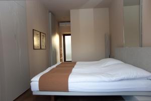 Postel nebo postele na pokoji v ubytování Assosyal Hotel