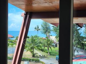 a view of the beach from a window at Lanta Mermaid Boutique House in Ko Lanta