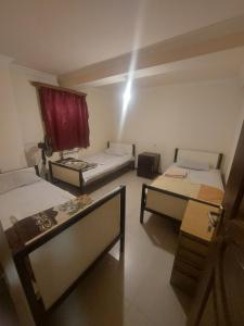 Voodi või voodid majutusasutuse Home Hotel toas