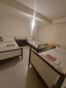Voodi või voodid majutusasutuse Home Hotel toas