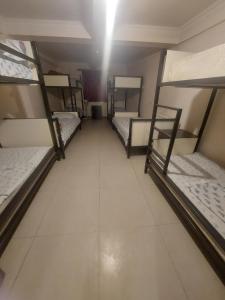 Voodi või voodid majutusasutuse Home Hotel toas