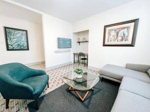 a living room with a couch and a table at Picaflor 7 Amazing Cozy Apt @ Miramar in San Juan