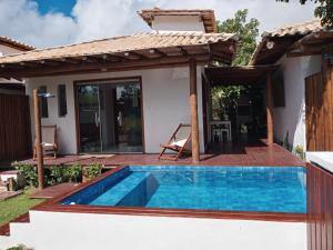 a pool in the backyard of a house at Casa, 2 Suítes com Ar, Piscina a 400 mts Praia - Taipu de Fora, Barra Grande #2 in Marau