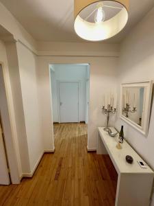 an empty living room with a white table and candles at Appartement Hyper Centre Place Kléber in Strasbourg