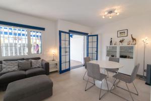 a living room with a couch and a table at Casa Rosanna in Playa Blanca