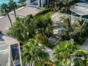 an overhead view of palm trees and a building at Fabulous full sea view 3br bluewaters Island in Dubai