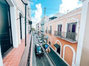 a view of a street with cars parked on the street at Tanca 255 Spacious Colonial House @ Old San Juan in San Juan