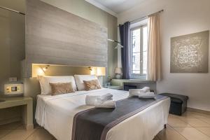 Postel nebo postele na pokoji v ubytování Crossroad Hotel