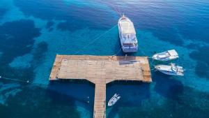 an aerial view of a dock with boats in the water at Amwaj Beach Club Abu Soma in Hurghada