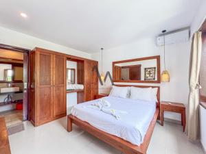 Postel nebo postele na pokoji v ubytování Villa Alamanda Canggu Bali