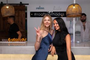 two women standing next to each other in a store at Hotel Parthenon Rodos city in Rhodes Town