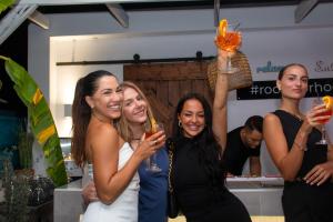 a group of women holding up wine glasses at Hotel Parthenon Rodos city in Rhodes Town