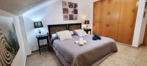 A bed or beds in a room at La Pausa