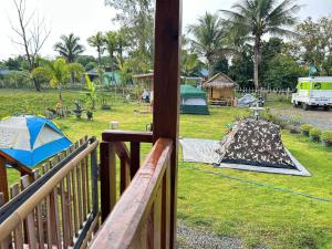 a view from a deck of a yard with a tent at PJ Kingdom Camps 