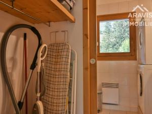 a bathroom with a heater and a window at Appartement Le Grand-Bornand, 5 pièces, 8 personnes - FR-1-391-10 in Le Grand-Bornand