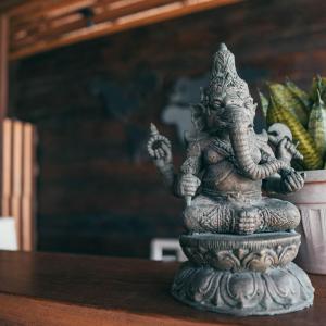 a statue of an elephant sitting on a table at Santa Maria Atins in Atins