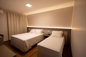 Safa Hotel Foz客房内的一张或多张床位