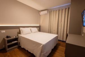 Safa Hotel Foz客房内的一张或多张床位