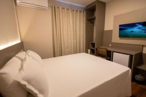 Safa Hotel Foz客房内的一张或多张床位