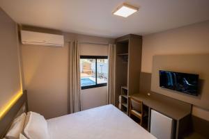 Safa Hotel Foz客房内的一张或多张床位